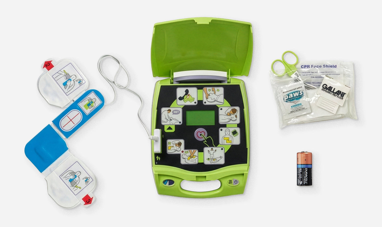 Open green automated external defibrillator with electrode pads, battery, scissors, CPR face shield, and wipes displayed on a white background