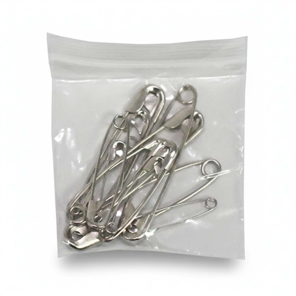 Safety Pins (Assorted Sizes) - Pack of 12 in clear resealable bag for securing bandages and first aid supplies.
