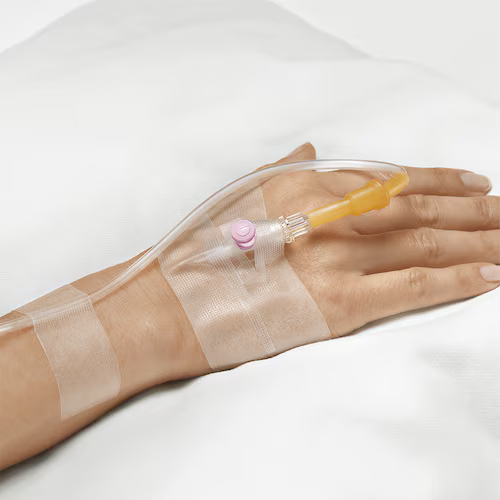 Leukofix Tape securing a catheter on a hand, transparent medical tape designed for sensitive skin and residue-free removal