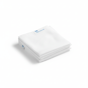 Stack of clean Disposable Linen Sheet folded neatly on white background for hygienic use