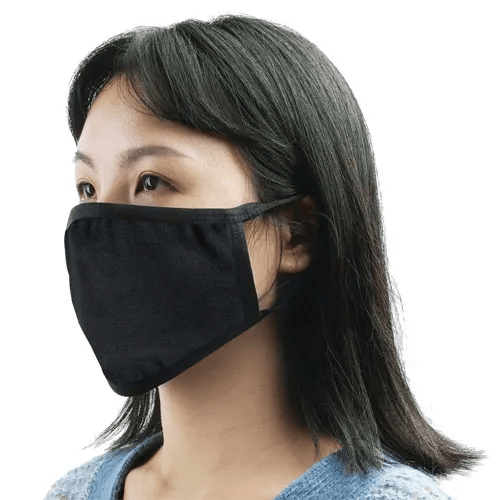 Woman wearing a black Reusable Cotton Face Mask - Single with elastic ear straps, comfortable and protective cotton layers.