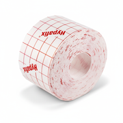 Hypafix Retention Bandage rolled up showing grid pattern for easy cutting, used in first aid supplies and wound care.