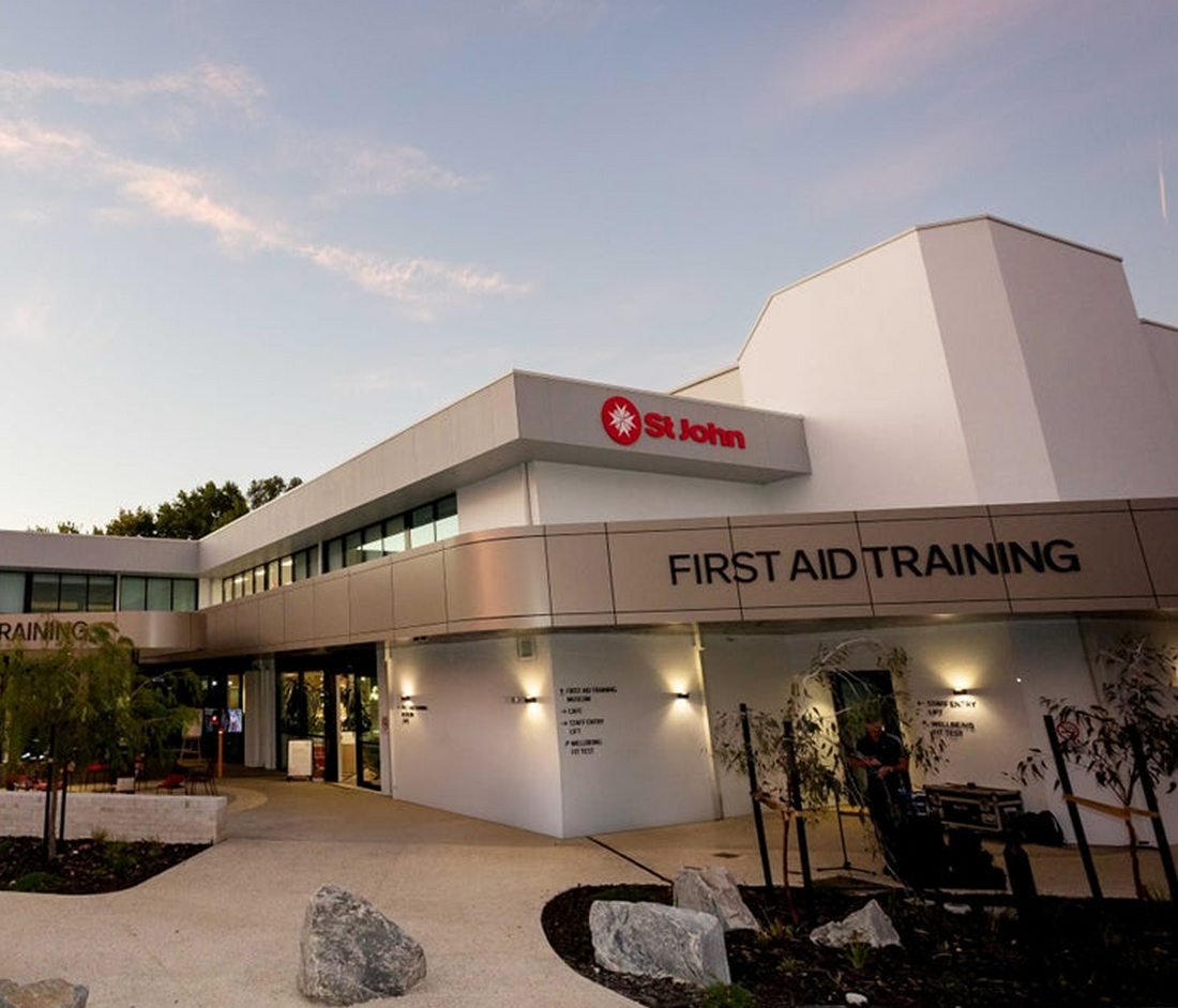 St. John's First Aid Training center building with 'St. John' logo on a clear day.